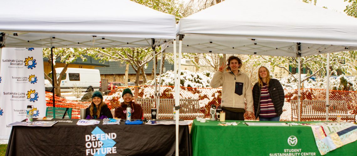 Defend Our Future and SSC Officers Trevor Akiyama and Bella Conrad table at the Fort Collins Earth Day Festival at the Civic Center Park April 20. (Samantha Nordstrom | The Green Bulletin)