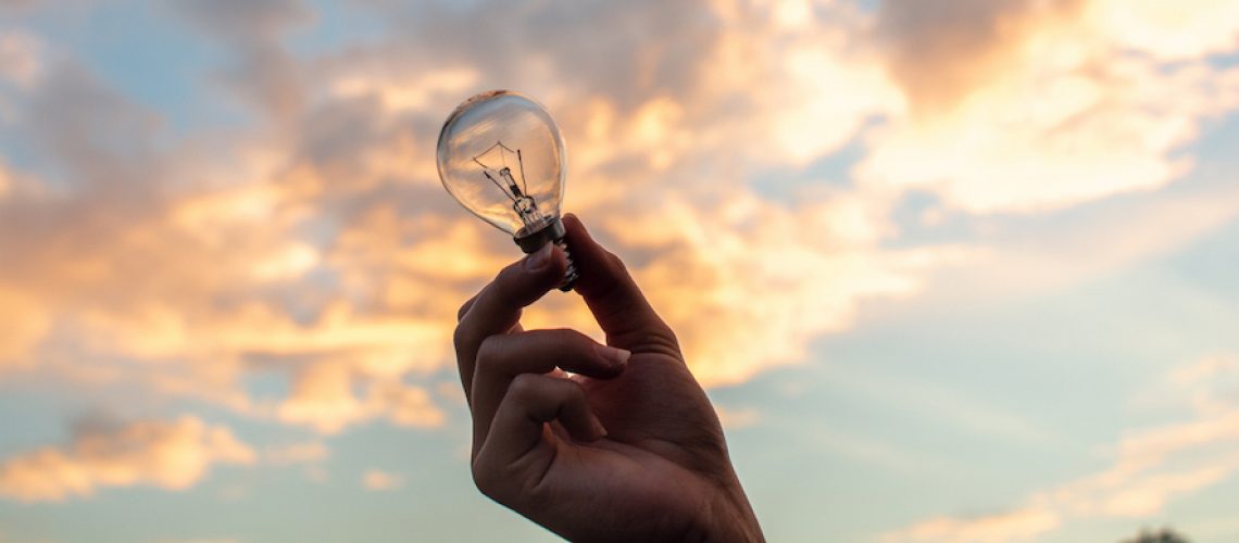 Canva - Person Holding Clear Light Bulb
