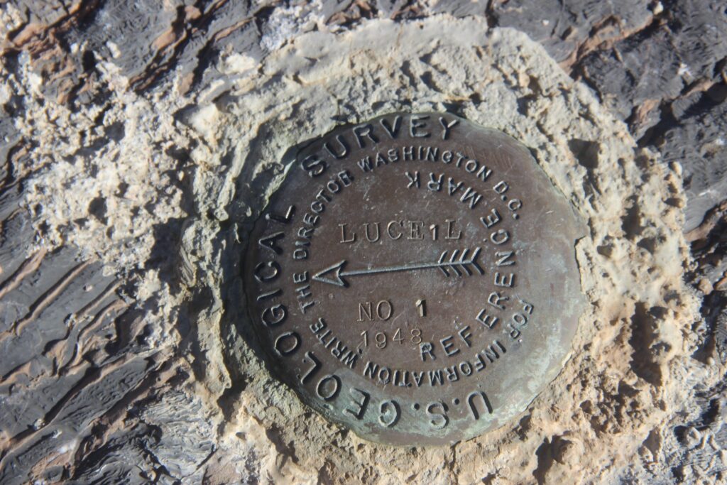 USGS metal marker embedded in stone in Inyo County, CA.
