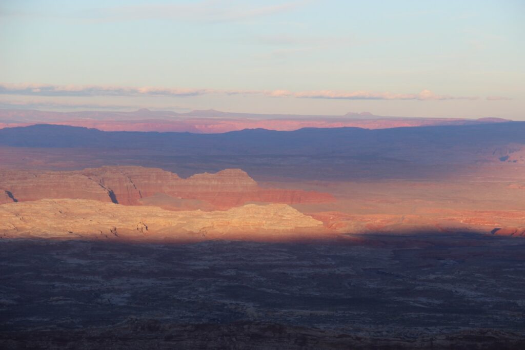 Rocky canyons and plateaus at sunset.