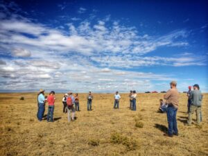 Group of people in a grassy field