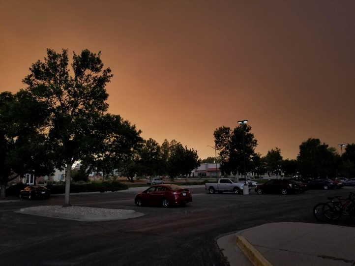 Smoke filled air above a parking lot