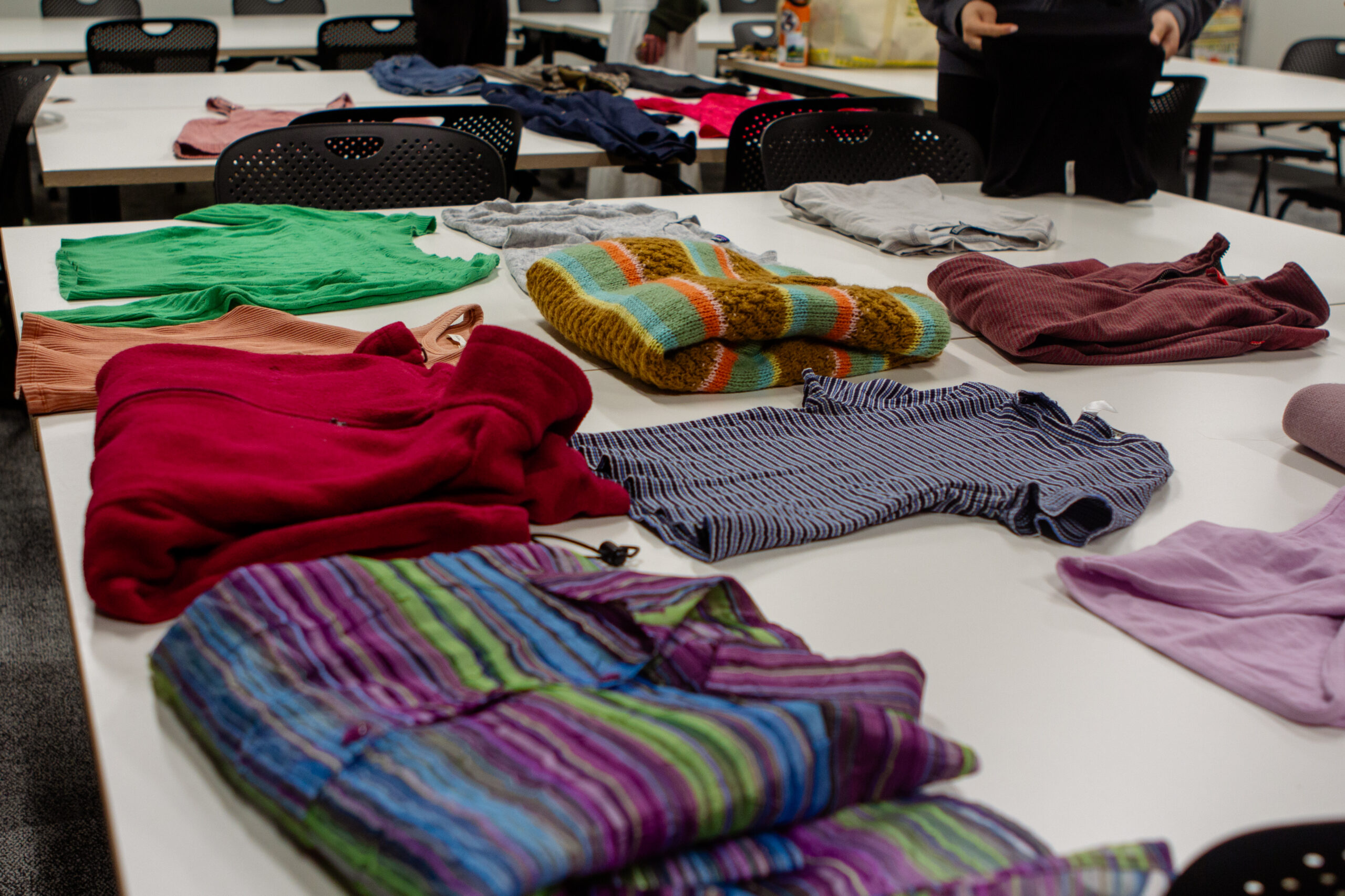 Clothes are neatly folded on a table inside.
