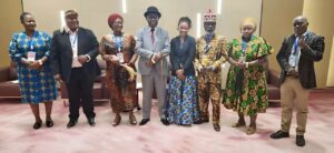 Munsaka posing with group of african colleagues