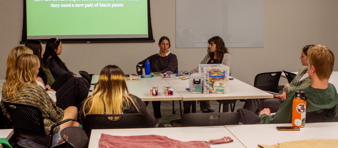 People listen intently to a presentation inside.