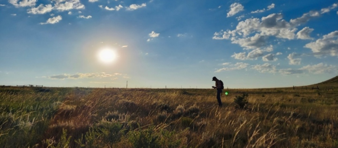Figure 2. Anna Clare Monlezun conducting field work, Soapstone Prairie Natural Area.
