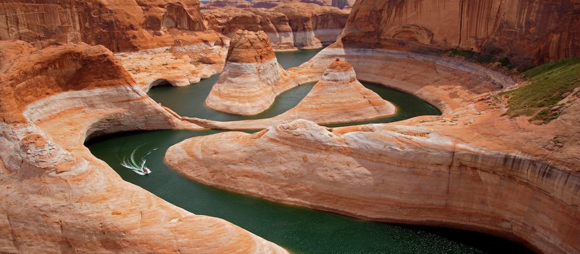 The gap between the bathtub rings —or high water mark — and the water level are ever-widening in Lake Powell. A "lake" in a landscape that was never intended for water storage.